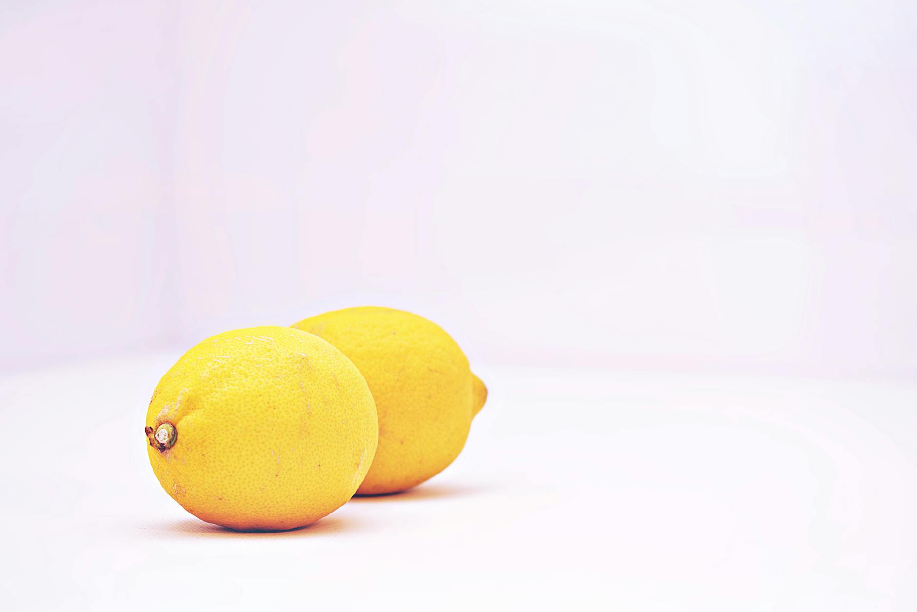 Two hands holding vibrators as a couple explores intimacy together