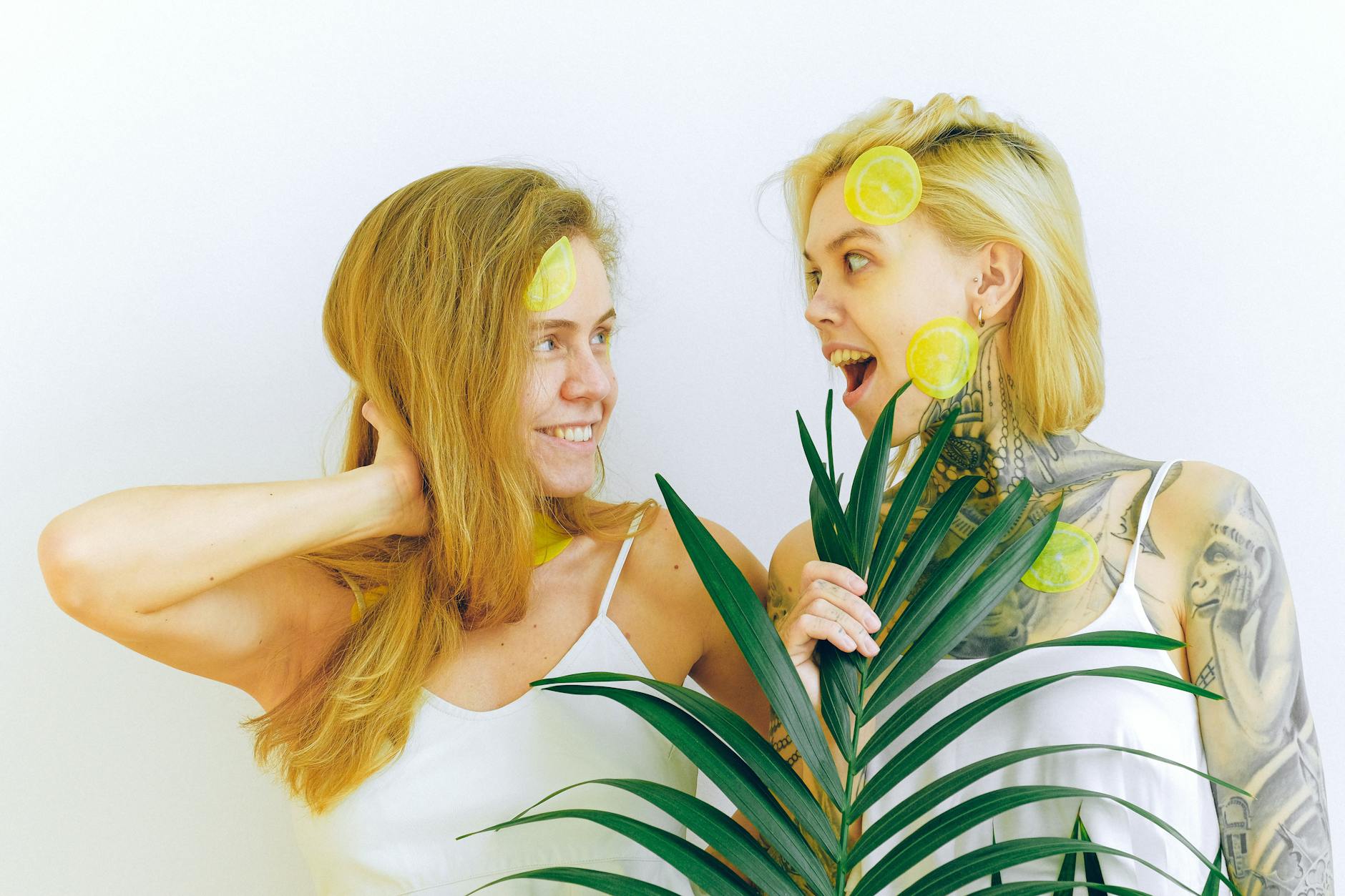 Two women laughing and enjoying intimate time together with joy and confidence